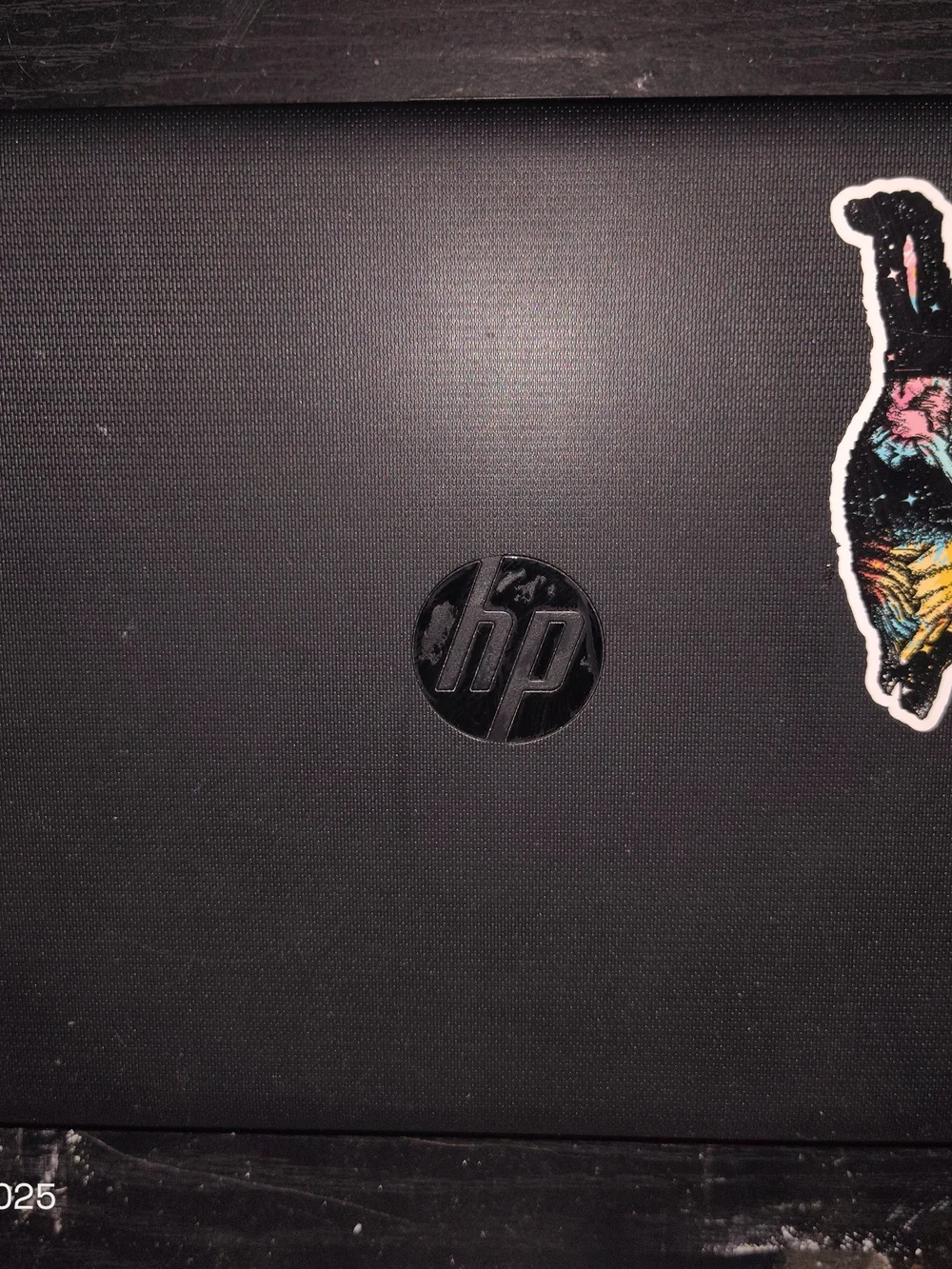 HP Black Laptop Lid with Colorful Sticker